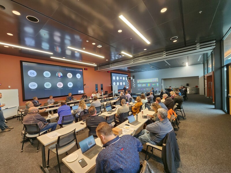 Image of a MAETL Meeting with attendees in person and hybrid via Microsoft Teams that was held at the U of M SmartPark location.